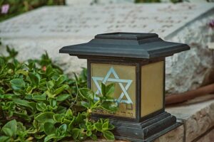 brown and black wooden candle holder with star of david