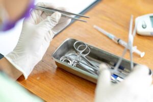 hands of doctor preparing for surgery