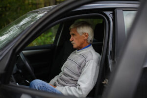 man sitting in a car after test drive